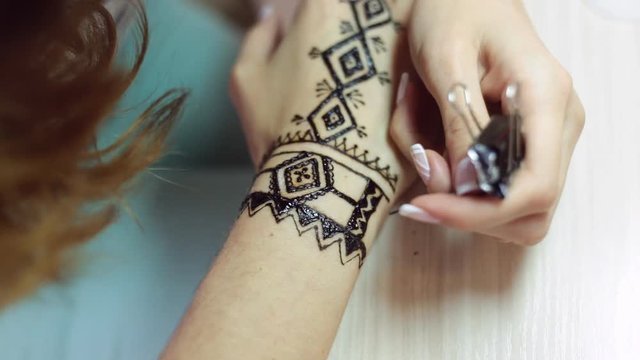 Henna tattoo on women hands