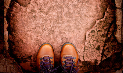top view boots on stoned pathway with copyspace