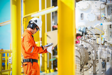 operator recording operation of oil and gas process at oil and rig plant, offshore oil and gas...