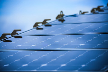 Solar Cell Generated Electrical Power by Sun Light, Closeup of Blue Photovoltaic Solar Panels, Green Energy for Safe World, Power Supply and Generated Electrical Power to Battery, 