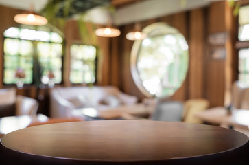 Selected focus empty brown wooden table and Coffee shop blur bac