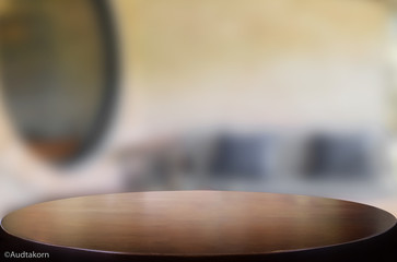 Selected focus empty brown wooden table and Coffee shop blur bac