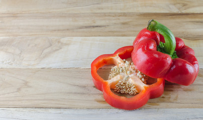 red bell pepper on wooden