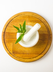 Fresh spearmint herb in the mortar