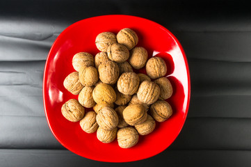walnuts in red plate