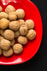 walnuts in red plate