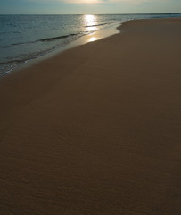 Wave of the sea on the sand beach