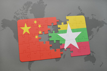 puzzle with the national flag of china and myanmar on a world map background.