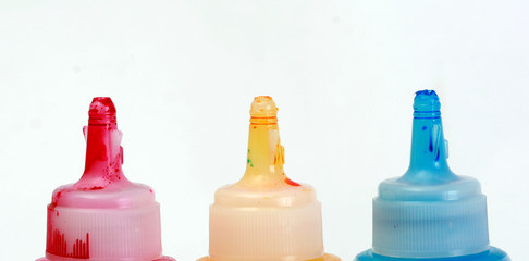 bottles of ink printer cartridges on white background.