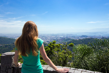 Fototapeta na wymiar girl tourist looks at Rio landscape