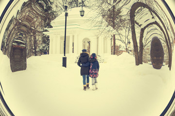 Two girls in the Park alley in winter