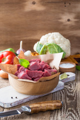 Raw veal cut into pieces with vegetables and other ingredients