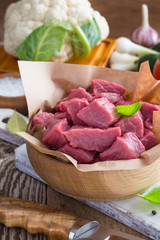 Raw veal cut into pieces with vegetables and other ingredients