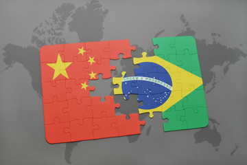 puzzle with the national flag of china and brazil on a world map background.