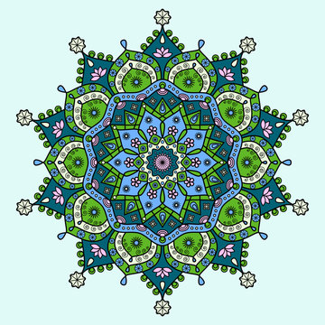 Mandala in dark cyan blue, bright lime green, pink & creamy white on light blue background. 