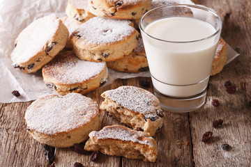 Tasty Welsh cakes with raisins and milk close-up. horizontal
