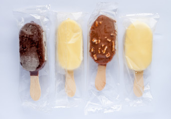 four ice creams in plastic transparent bags