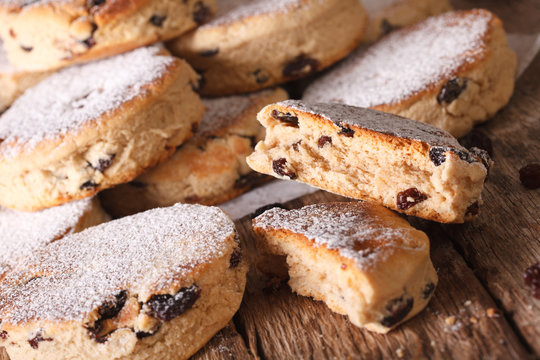 Traditional Welsh cakes with raisins and powdered sugar macro. Horizontal
