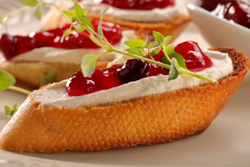Toast with white cottage cheese cherry jam and fresh herbs