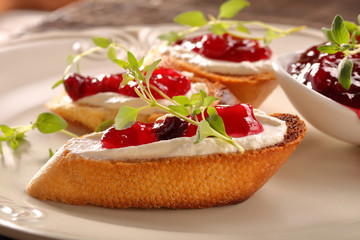 Toast with white cottage cheese cherry jam and fresh herbs