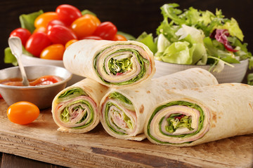 Fresh tortilla wraps with ham cheese and vegetables