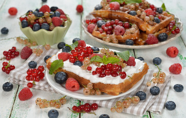 Waffles with whipped cream and berries