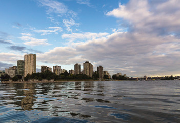 Obraz premium View of English Bay Beach and Residential Buildings in Downtown Vancouver from the water during sunset.