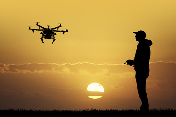 man with drone - obrazy, fototapety, plakaty