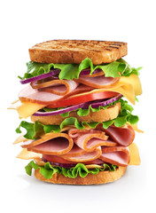 Big sandwich with ham and vegetables isolated on white backgroun