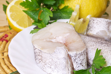 fish, hake on wooden background