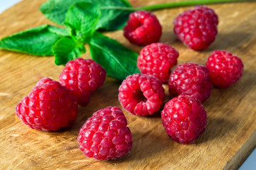 Raspberries and a sprig of mint