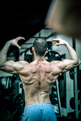 Man showing back in gym