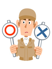 問題を考える作業着の男性
