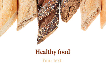 Cut baguette bread of different varieties on a white background. Rye, wheat and whole grain bread....