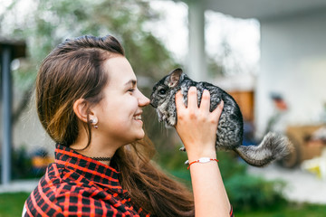 girl playing with her chinchilla