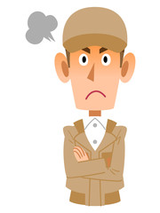 怒る作業着の男性
