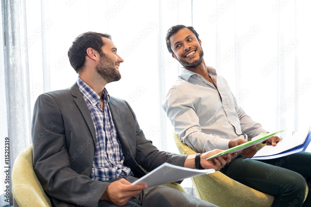 Wall mural businessman interacting with coworker