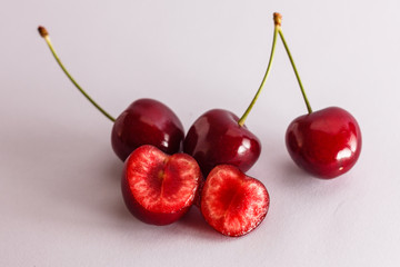 Obraz na płótnie Canvas Cut juicy red cherries