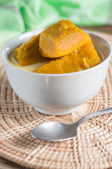 Thai style dessert, hot pumpkin in coconut milk.