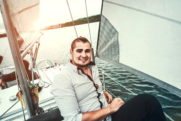 Young man outdoor relaxing on the yacht