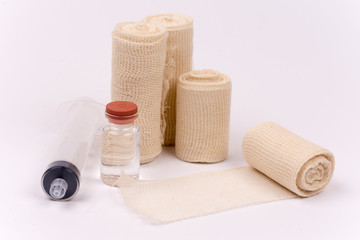 Bandage rolls and injection syringe bottle