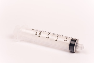Plastic syringe isolated over white background