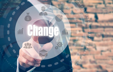 Businessman pressing a Change concept button on a circular displ