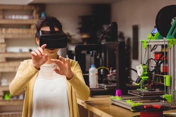 Female graphic designer using the virtual reality headset