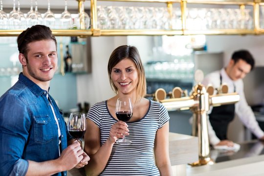 Happy young couple with wineglass 