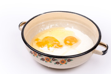 Preparing pancakes with eggs and flour