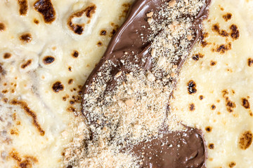 Pancakes with nutella cream and grated biscuits