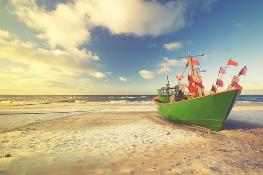 Vintage Retro Stylized Photo Of Fishing Boats On The Sea Beach