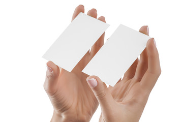 Business cards in female hand isolated at white background.