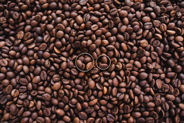 Wedding rings in coffee grains